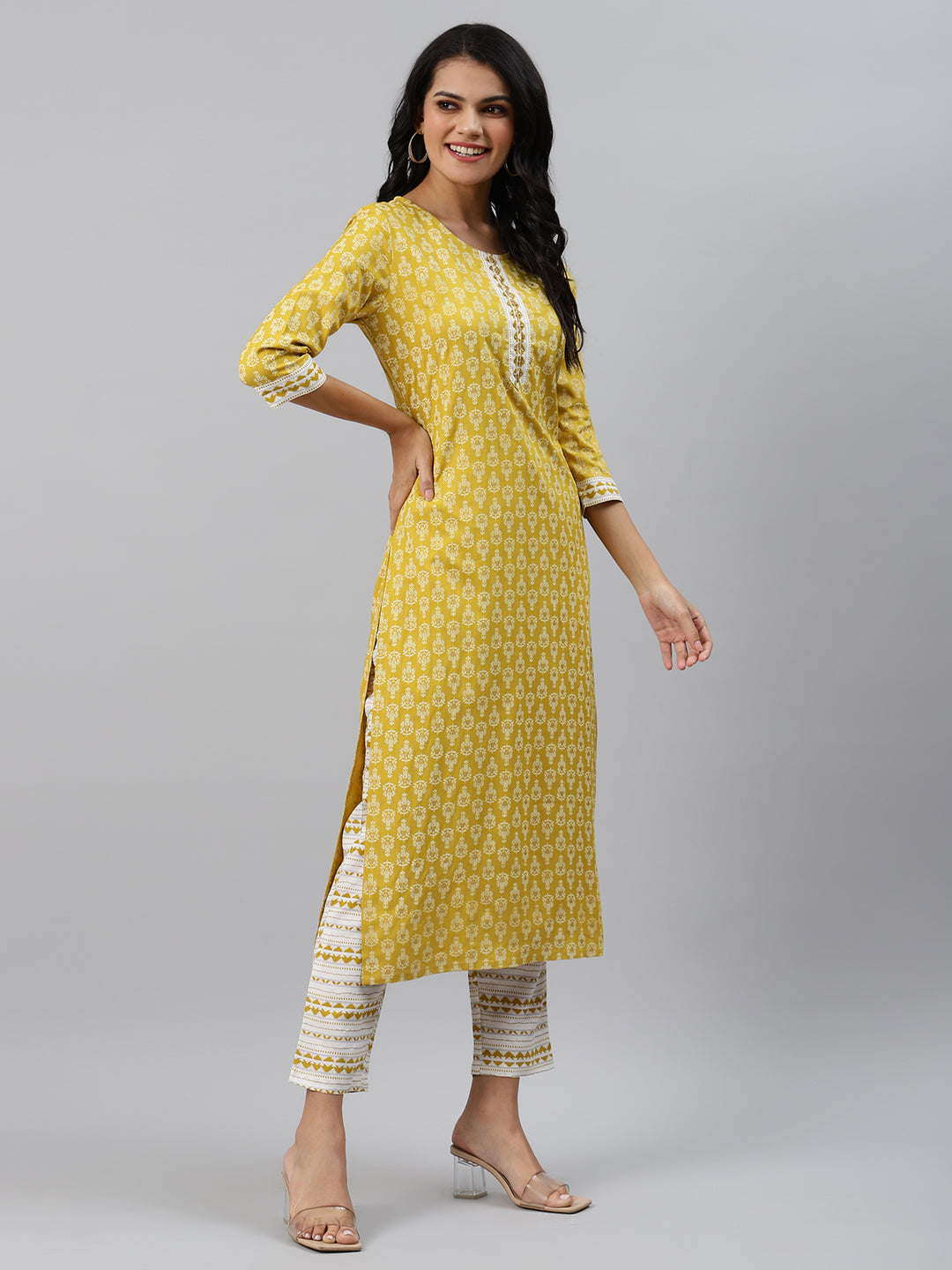 Women Yellow Printed Hand detailing Kurta with Trousers